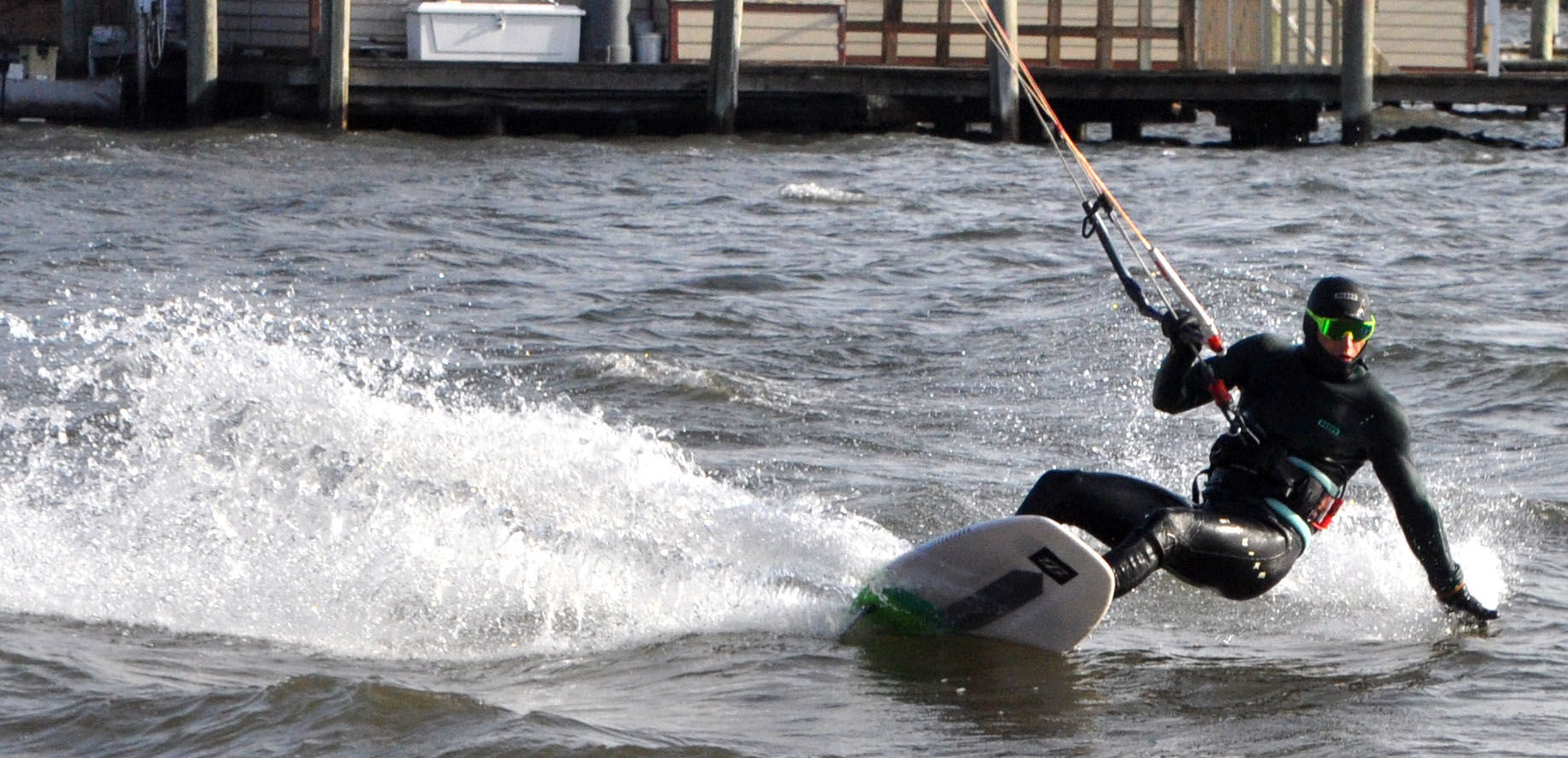 Charlie Vogel kicks up some water during a lap of kite boarding